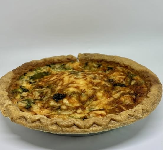 A fresh-baked broccoli and cheese quiche
